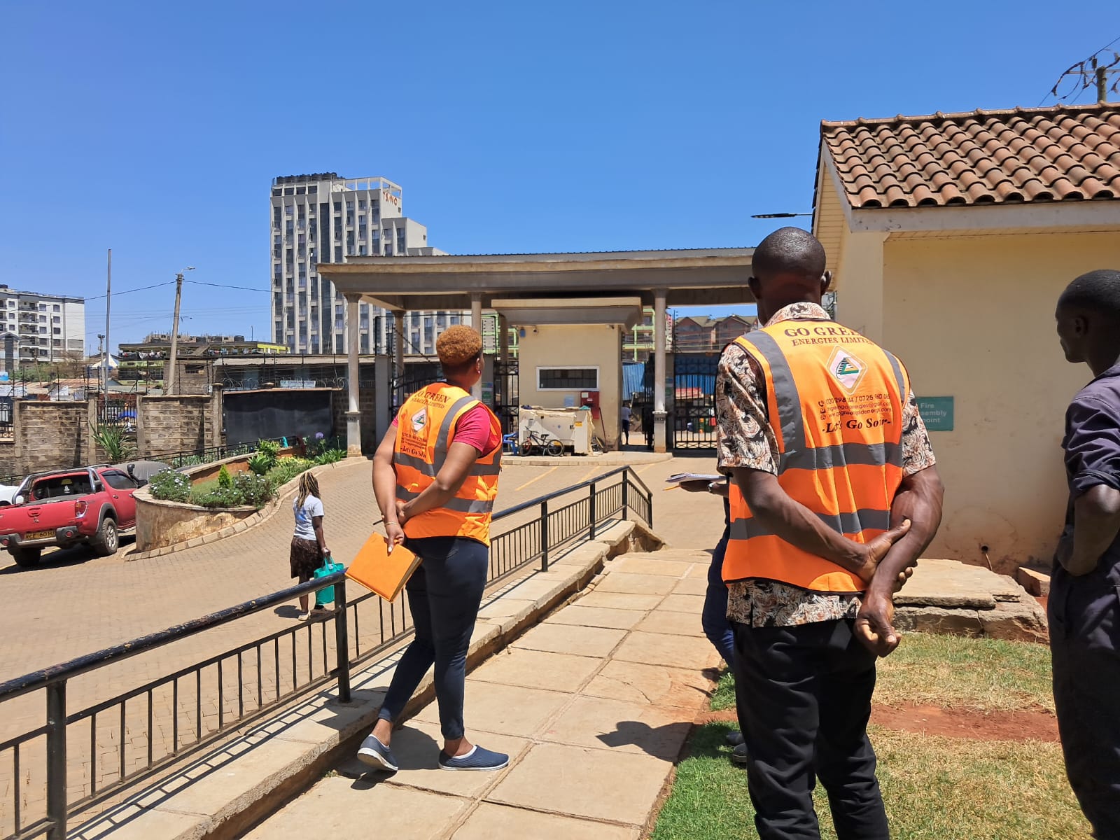 Go Green Gold staff in branded hi-vis vests arriving at a site